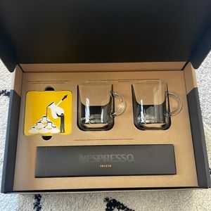 Vertuo nespresso coffee mugs with Nespresso capsules and two coasters